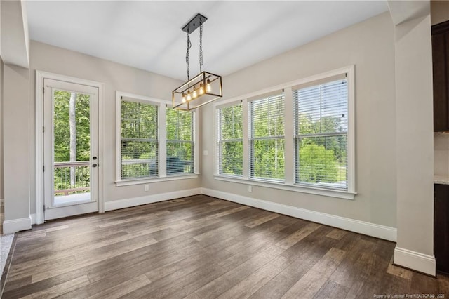 405 Gilpin Way, Cary, NC 27519 - unfurnished dining area featuring dark wood-style floors and a chandelier