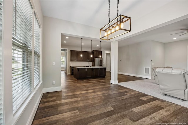 405 Gilpin Way, Cary, NC 27519 - kitchen featuring open floor plan, freestanding refrigerator, dark brown cabinets, and dark wood-style floors