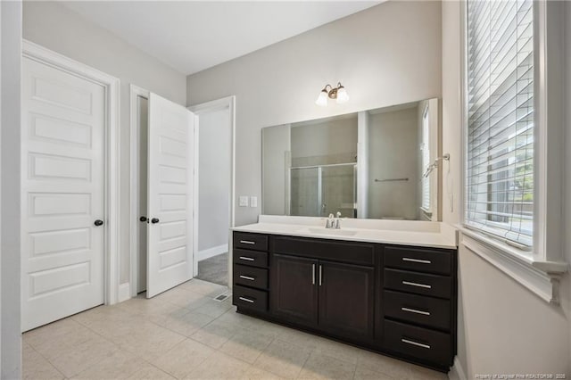 405 Gilpin Way, Cary, NC 27519 - bathroom with vanity, a stall shower, and tile patterned floors