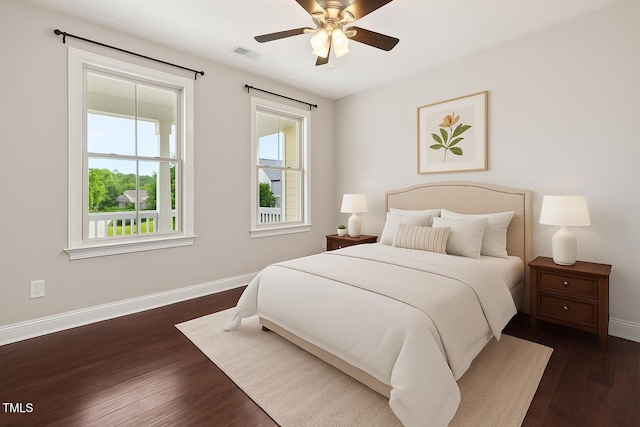 1600 Drift Falls Ln, Wendell, NC 27591 - bedroom with baseboards, dark wood-style floors, and a ceiling fan
