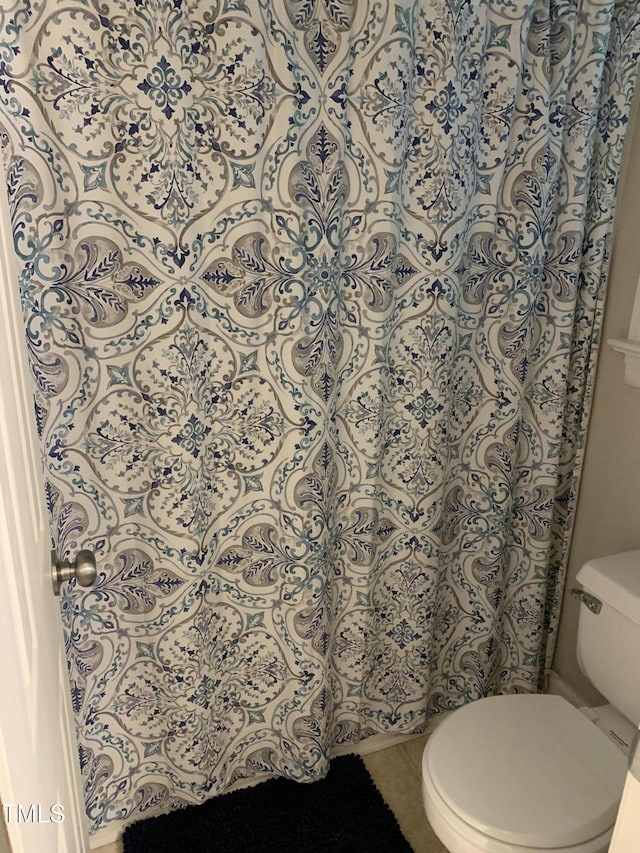 352 Riverstone Dr, Clayton, NC 27527 - full bathroom with toilet, tile patterned flooring, and curtained shower