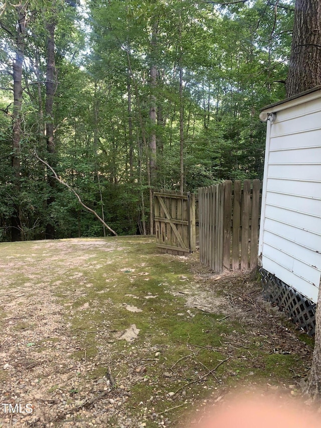 352 Riverstone Dr, Clayton, NC 27527 - view of yard with a gate