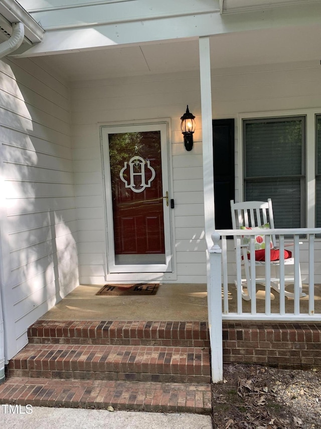 352 Riverstone Dr, Clayton, NC 27527 - doorway to property featuring a porch