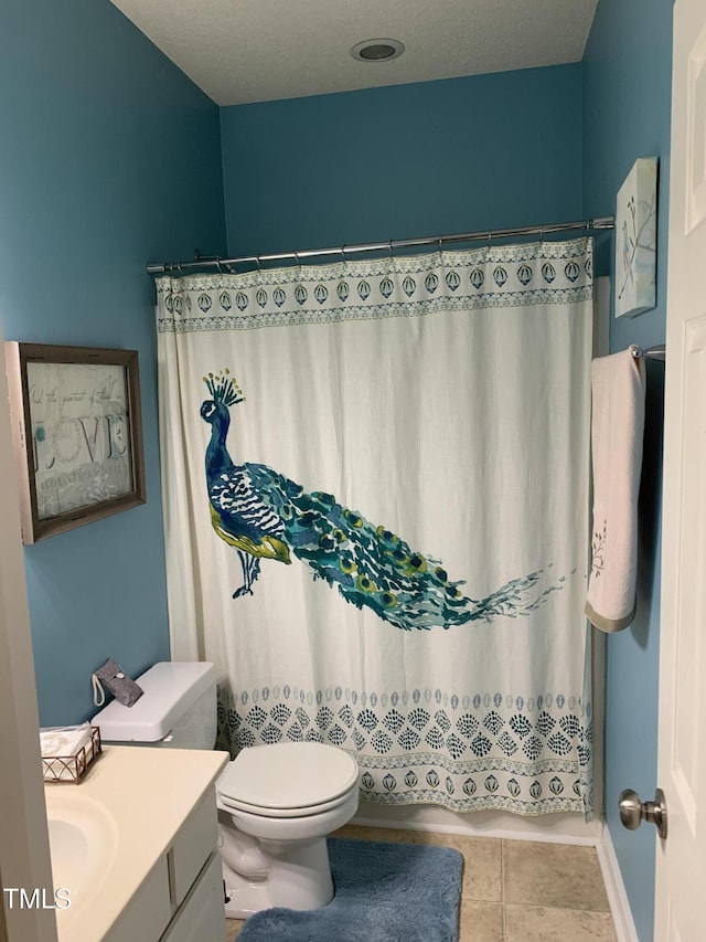 352 Riverstone Dr, Clayton, NC 27527 - bathroom featuring vanity, toilet, tile patterned floors, and a shower with shower curtain