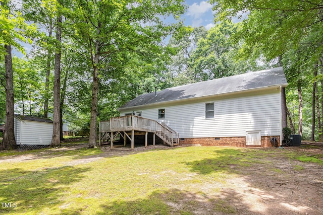 352 Riverstone Dr, Clayton, NC 27527 - rear view of house featuring stairway, crawl space, a deck, a lawn, and a storage shed