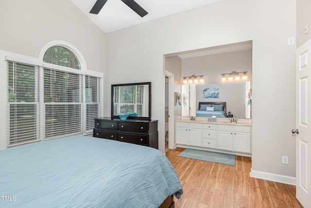352 Riverstone Dr, Clayton, NC 27527 - bedroom featuring light wood finished floors, high vaulted ceiling, ensuite bath, and a ceiling fan