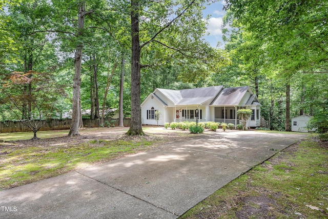 352 Riverstone Dr, Clayton, NC 27527 - ranch-style house with a porch and driveway