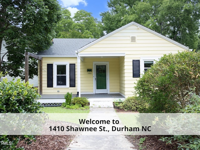 1410 Shawnee St, Durham, NC 27701 - bungalow-style home with roof with shingles and covered porch