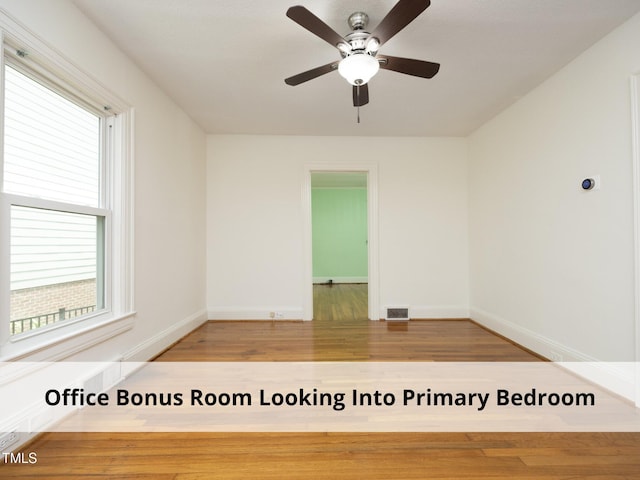 1410 Shawnee St, Durham, NC 27701 - spare room with wood finished floors and a ceiling fan