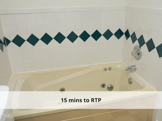 1410 Shawnee St, Durham, NC 27701 - full bathroom featuring a tub with jets