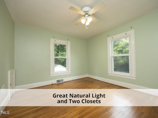 1410 Shawnee St, Durham, NC 27701 - spare room with plenty of natural light, wood finished floors, and ceiling fan