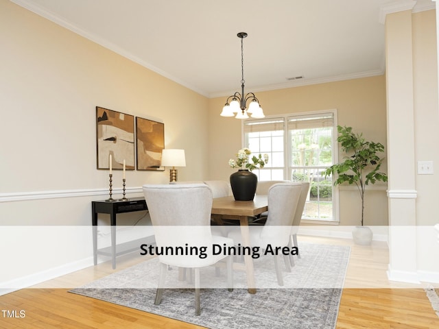 603 Red Cedar Cir, Durham, NC 27712 - dining space featuring a chandelier, wood finished floors, and crown molding