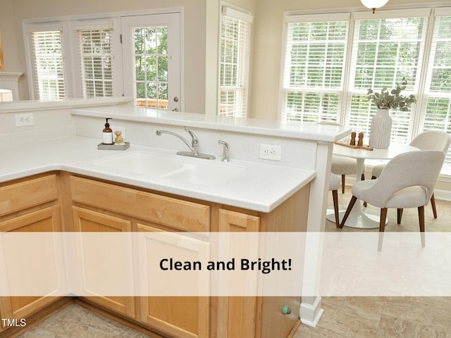 603 Red Cedar Cir, Durham, NC 27712 - kitchen featuring light countertops and light brown cabinetry