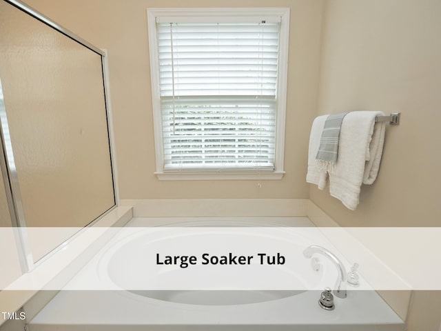 603 Red Cedar Cir, Durham, NC 27712 - full bath with a bath and a shower with door