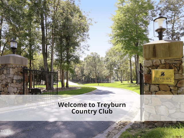 603 Red Cedar Cir, Durham, NC 27712 - view of asphalt street featuring street lights and curbs