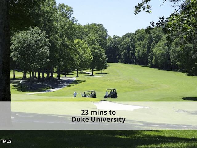 603 Red Cedar Cir, Durham, NC 27712 - view of home's community with golf course view and a lawn