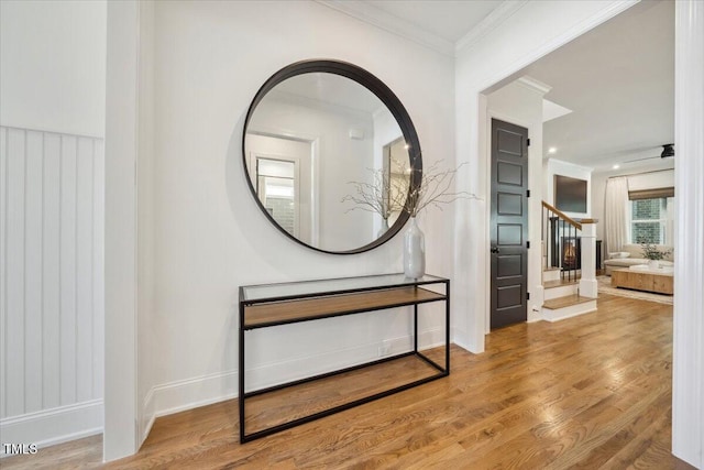 245 Tumbling River Dr, Wendell, NC 27591 - hallway featuring ornamental molding, wood finished floors, stairs, and baseboards