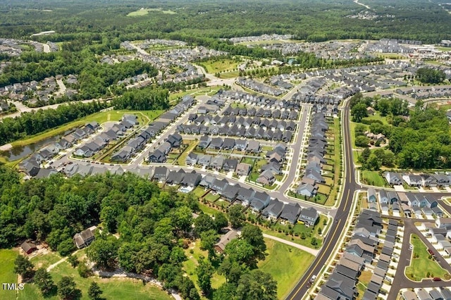 245 Tumbling River Dr, Wendell, NC 27591 - aerial overview of property's location with nearby suburban area and a heavily wooded area
