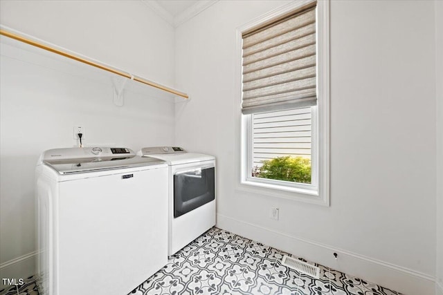245 Tumbling River Dr, Wendell, NC 27591 - laundry area featuring washer and clothes dryer, baseboards, crown molding, and light tile patterned floors