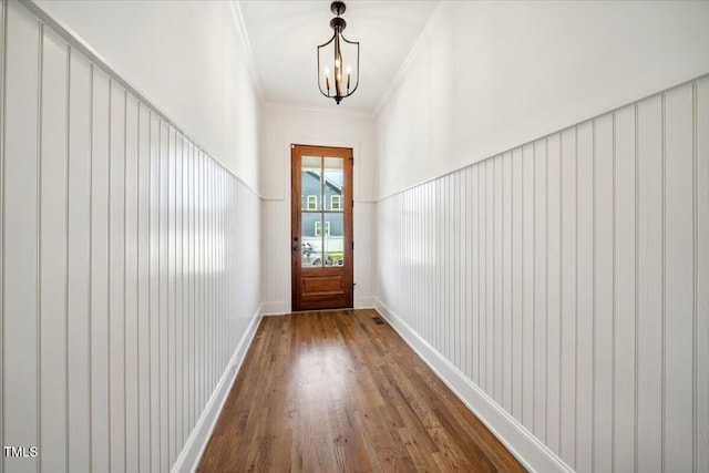 245 Tumbling River Dr, Wendell, NC 27591 - doorway to outside featuring wood finished floors, crown molding, and a chandelier