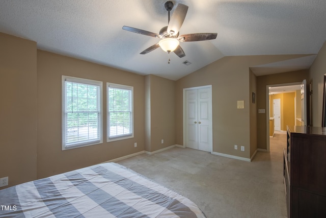 203 Halls Mill Dr, Cary, NC 27519 - unfurnished bedroom with light colored carpet, vaulted ceiling, baseboards, a textured ceiling, and a closet