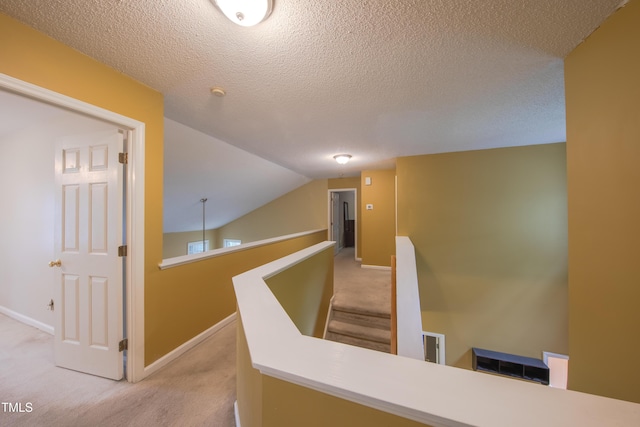 203 Halls Mill Dr, Cary, NC 27519 - corridor with an upstairs landing, carpet flooring, baseboards, and a textured ceiling