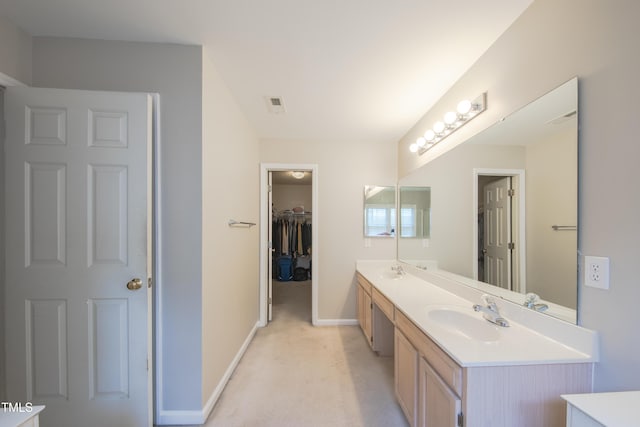 203 Halls Mill Dr, Cary, NC 27519 - bathroom with double vanity, baseboards, and a spacious closet