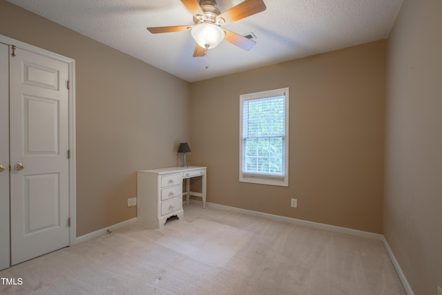 203 Halls Mill Dr, Cary, NC 27519 - unfurnished office with light colored carpet, a ceiling fan, a textured ceiling, and baseboards