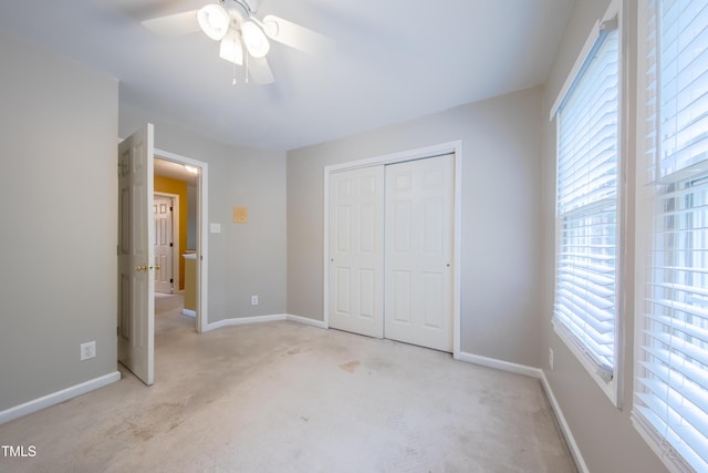 203 Halls Mill Dr, Cary, NC 27519 - unfurnished bedroom featuring light colored carpet, a closet, baseboards, and a ceiling fan