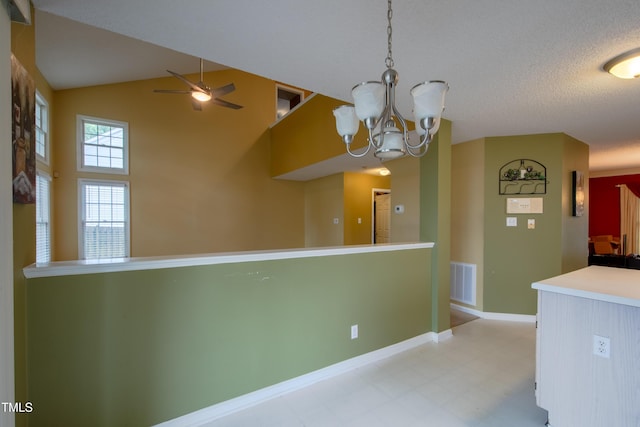 203 Halls Mill Dr, Cary, NC 27519 - kitchen with ceiling fan, light floors, a chandelier, baseboards, and high vaulted ceiling