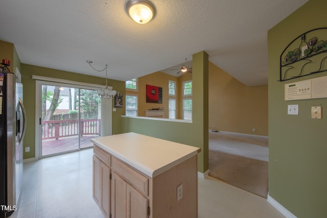 203 Halls Mill Dr, Cary, NC 27519 - kitchen featuring freestanding refrigerator, healthy amount of natural light, ceiling fan, light floors, and a textured ceiling