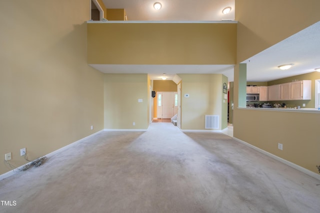 203 Halls Mill Dr, Cary, NC 27519 - unfurnished living room with light colored carpet and baseboards