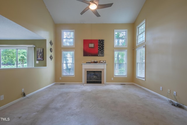 203 Halls Mill Dr, Cary, NC 27519 - unfurnished living room featuring carpet, ceiling fan, a glass covered fireplace, baseboards, and high vaulted ceiling