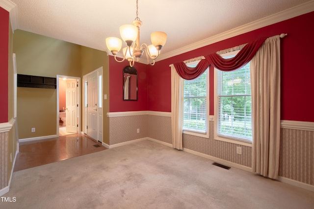 203 Halls Mill Dr, Cary, NC 27519 - unfurnished dining area with carpet, a chandelier, and a wainscoted wall