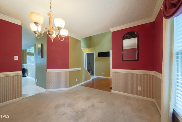 203 Halls Mill Dr, Cary, NC 27519 - carpeted empty room featuring a chandelier, healthy amount of natural light, crown molding, and a textured ceiling