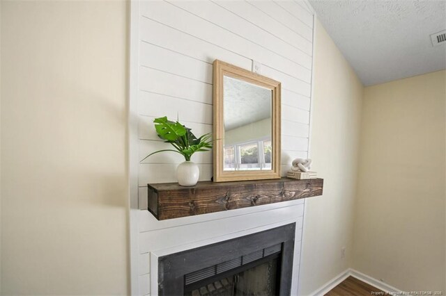 6466 Applewhite Rd, Fayetteville, NC 28304 - detailed view of a fireplace, wood finished floors, and baseboards