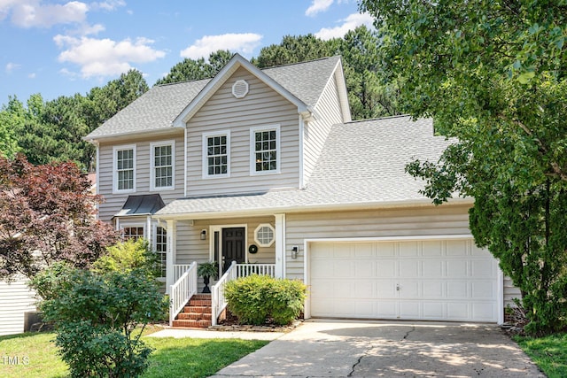 8512 Erinsbrook Dr, Raleigh, NC 27617 - traditional-style home with roof with shingles, driveway, a garage, and covered porch