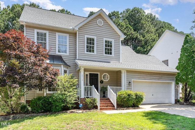 8512 Erinsbrook Dr, Raleigh, NC 27617 - traditional-style house with a garage, driveway, a front yard, and roof with shingles