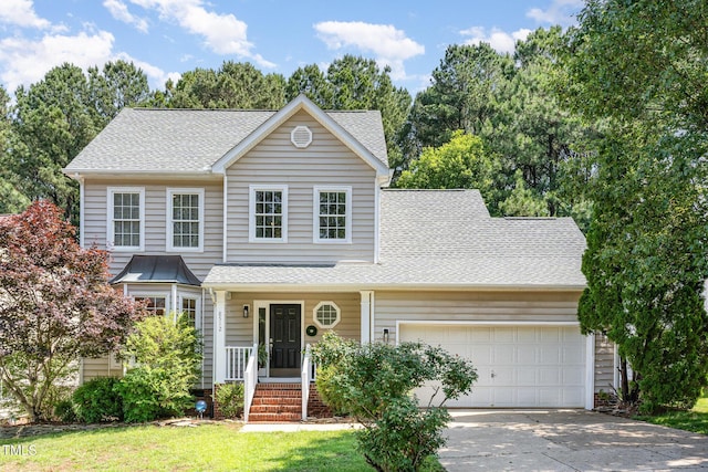 8512 Erinsbrook Dr, Raleigh, NC 27617 - traditional-style home with an attached garage, a shingled roof, and driveway