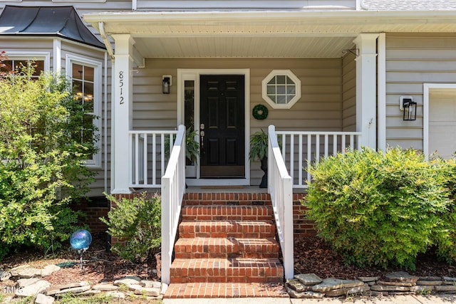 8512 Erinsbrook Dr, Raleigh, NC 27617 - property entrance with a porch