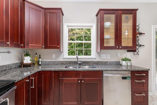8512 Erinsbrook Dr, Raleigh, NC 27617 - kitchen featuring stainless steel dishwasher, a sink, dark brown cabinets, dark stone countertops, and glass insert cabinets