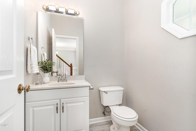 8512 Erinsbrook Dr, Raleigh, NC 27617 - bathroom featuring toilet, vanity, and baseboards