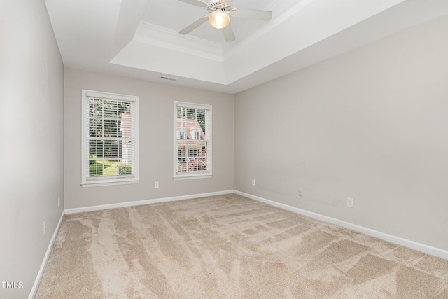 8512 Erinsbrook Dr, Raleigh, NC 27617 - carpeted empty room with a raised ceiling, baseboards, ceiling fan, and crown molding
