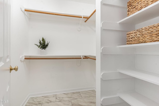 8512 Erinsbrook Dr, Raleigh, NC 27617 - walk in closet featuring marble look tiles