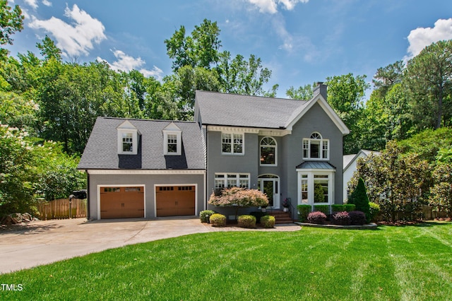 3304 Buck Run Trl, Wake Forest, NC 27587 - view of front of house featuring a chimney, concrete driveway, roof with shingles, and a garage