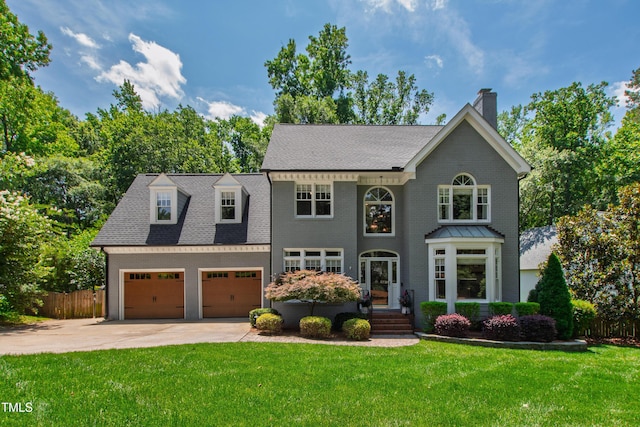 3304 Buck Run Trl, Wake Forest, NC 27587 - view of front of property with concrete driveway, a chimney, a garage, and roof with shingles
