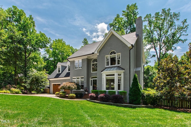 3304 Buck Run Trl, Wake Forest, NC 27587 - colonial-style house with an attached garage, driveway, and a chimney