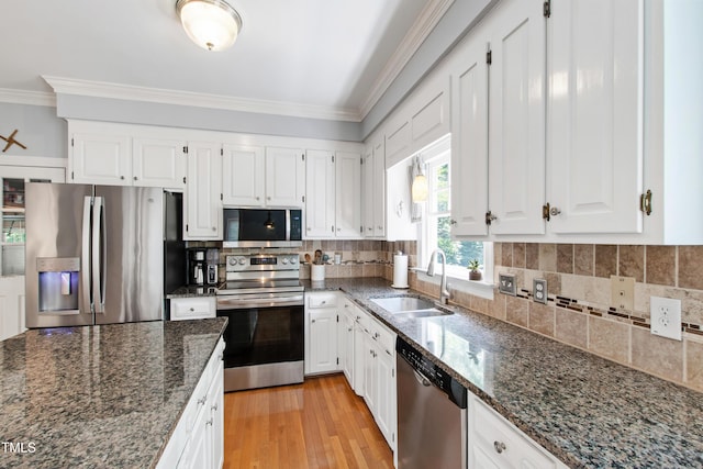 3304 Buck Run Trl, Wake Forest, NC 27587 - kitchen with appliances with stainless steel finishes, ornamental molding, and white cabinetry
