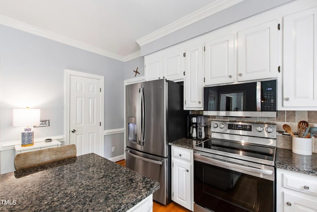 3304 Buck Run Trl, Wake Forest, NC 27587 - kitchen with stainless steel appliances, ornamental molding, white cabinetry, dark stone counters, and light wood-style flooring