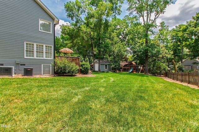 3304 Buck Run Trl, Wake Forest, NC 27587 - view of yard featuring a storage shed, a playground, and a wooden deck